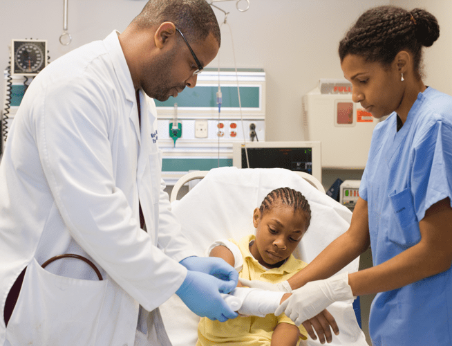 Medical professionals attending to a young patient who may have been exposed to rabies.